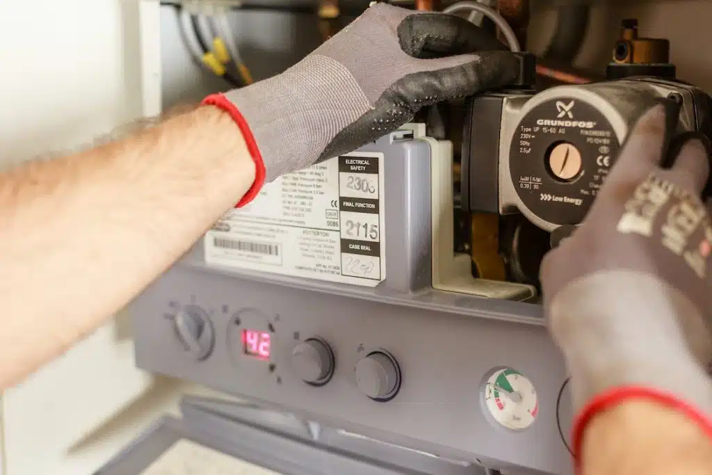 Professional HVAC technician servicing residential heating and cooling system in Santa Fe